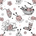 Seamless pattern on the theme of knitting with a basket and balls of yarn and a cute cat. Vector Royalty Free Stock Photo