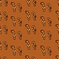 Seamless pattern of thin brown outline candy cand with ribbon isolated on brown background. hand drawn vector. doodle for christma Royalty Free Stock Photo