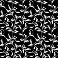 Seamless pattern. Thin delicate twigs with decorative leaves on black background. Luxurious texture