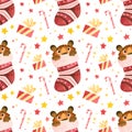 Seamless pattern - Tiger cub hiding in Christmas stocking. Cute playful tiger cub character. Royalty Free Stock Photo
