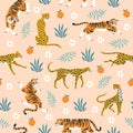 Seamless pattern tigers. Trendy tropical background with wild animals, jaguars, leopards, flowers, modern palm leaves Royalty Free Stock Photo