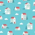 Seamless pattern of tiny geometric houses, clouds and trees in blue colors