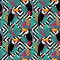 Seamless pattern with Toco toucan bird and tropical leaves Royalty Free Stock Photo