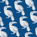 Seamless pattern with toucans on classic blue background