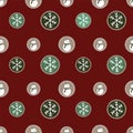 Seamless pattern of traditional winter holiday cookies with snowmen and snowflakes on a red background.