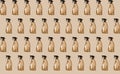 Seamless pattern of transparent plastic bottle of cleaning product, household window cleaning liquid on beige background