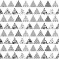 Seamless pattern of triangular patches of different patterns. Black and white background.