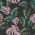 Seamless pattern with tropical leaves. Colored and bright green palm leaves on the black background. Royalty Free Stock Photo