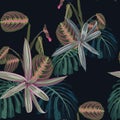 Seamless pattern with tropical leaves and exotic plants. Dark and bright palm leaves on the black background