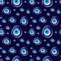 Seamless pattern with turkish traditional glass amulet boncuk, evil on dark blue background.