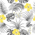 Seamless pattern of ultimate gray tropical leaves of palm tree and illuminating yellow flowers