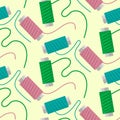 Seamless pattern using sewing thread. reels with threads in retro style on a yellow background. Colored threads are Royalty Free Stock Photo