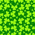 Seamless pattern. Vector illustration of clover leaves on green. St Patrick`s Day background.