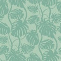 Seamless pattern with vertical silhouettes of monstera flower on a green background