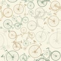 Seamless pattern with vintage bicycles on green background. Vector illustration.