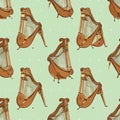 Seamless Pattern of Vintage Harps on a Light Green Background Royalty Free Stock Photo