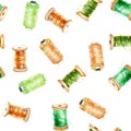 Seamless pattern with watercolor green and orange spools of thread Royalty Free Stock Photo