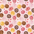 Seamless pattern with watercolor multicolored donuts on pink background Royalty Free Stock Photo