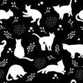 Seamless pattern with white cats silhouettes on black background. Cute kittens.Feline in different poses.Animals sit,lay,relax. Royalty Free Stock Photo