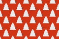 Seamless pattern of white clay Christmas tree toys in the form of Christmas trees on red background.