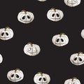 Seamless pattern with white Halloween pumpkins carved faces on black background. Can be used for scrapbook digital paper, textile Royalty Free Stock Photo