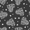 Seamless pattern with white hearts on dark background. Branches with leaves in the heart. Royalty Free Stock Photo