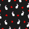 Seamless pattern white rabbits, red hearts on black background. Romantic bunny girly print, vector design eps 10 Royalty Free Stock Photo