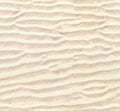 Seamless pattern of white sand. Repeating texture of waves on sandy beach background Royalty Free Stock Photo