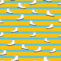 Seamless pattern with white womens shoes on blue and yellow striped background. Sneakers in flat style. Leather boots side view. Royalty Free Stock Photo