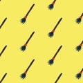 Seamless pattern with witch`s broom. Halloween illustration. Brown and orange colors on yellow board. Halloween costume Royalty Free Stock Photo
