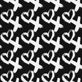 Seamless pattern XOXO with hearts on black background. Hugs and kisses abbreviation symbol. Grunge hand written brush lettering XO