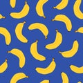 Seamless pattern with yellow bananas on blue background. Royalty Free Stock Photo