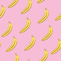 Seamless pattern of yellow bananas on a pink background Royalty Free Stock Photo