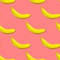 Seamless pattern of yellow bananas on a pink background. Banana print Royalty Free Stock Photo