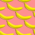 Seamless pattern of yellow bananas on a pink background. Banana print Royalty Free Stock Photo