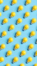 Seamless pattern of yellow light bulbs on a bright blue background Royalty Free Stock Photo