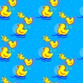 Seamless pattern with yellow rubber ducks on a blue background with geometric shapes Royalty Free Stock Photo