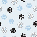 Seamless pet paw pattern. Cat or dog footprint on blue background.