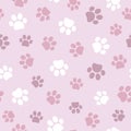 Seamless pet paw pattern. Cat or dog footprint on pink background. Royalty Free Stock Photo