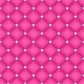 Seamless pink quilted background with pins. Royalty Free Stock Photo
