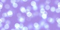 Seamless purple bokeh texture with blurry sliver light circles perfect for a party backdrop