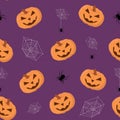 Seamless purple Halloween pattern. Jack o lantern, pumpkin and spider on purple background