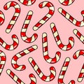 Seamless raster pattern candy lollipop red candy cane with white stripes on pink background Royalty Free Stock Photo