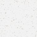 Seamless recycled speckled beige paper background. Vector paper texture with gold particles of debris.