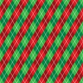 Seamless red and green argyle Christmas wrapping paper pattern. Royalty Free Stock Photo
