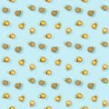 Seamless regular creative pattern with bright shiny little Christmas balls on blue paper Royalty Free Stock Photo