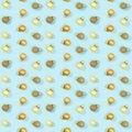 Seamless regular creative pattern with bright shiny little Christmas balls on blue paper. Royalty Free Stock Photo