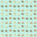 Seamless regular creative pattern with bright shiny little Christmas balls on mint color paper Royalty Free Stock Photo