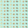 Seamless regular creative pattern with bright shiny little Christmas balls on mint colored paper Royalty Free Stock Photo