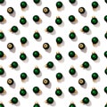 Seamless regular creative pattern with bright shiny little green Christmas balls isolated on white background Royalty Free Stock Photo